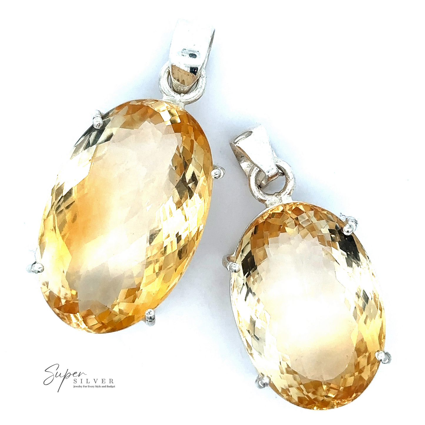 
                  
                    Two Brilliant Pronged Citrine Pendants with .925 Sterling Silver clasps. The gemstones, exhibiting a faceted cut, gleam brilliantly. The logo "Super Silver" is at the bottom left.
                  
                