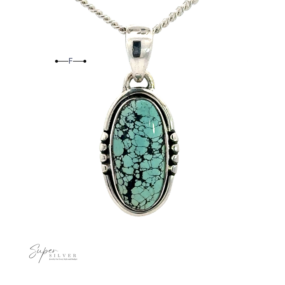 
                  
                    Natural Turquoise Elongated Oval Pendant with black matrix, encased in handmade sterling silver, hangs from a twisted silver chain. Logo in the bottom left corner reads "Super Silver.”
                  
                
