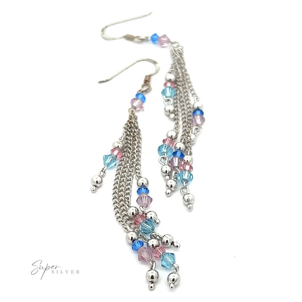 
                  
                    A pair of Layered Earrings with Multicolored Beads features multiple sterling silver chains adorned with small pink, blue, and clear multicolored beads. The earrings are arranged on a white background with the logo "Super Silver" visible.
                  
                