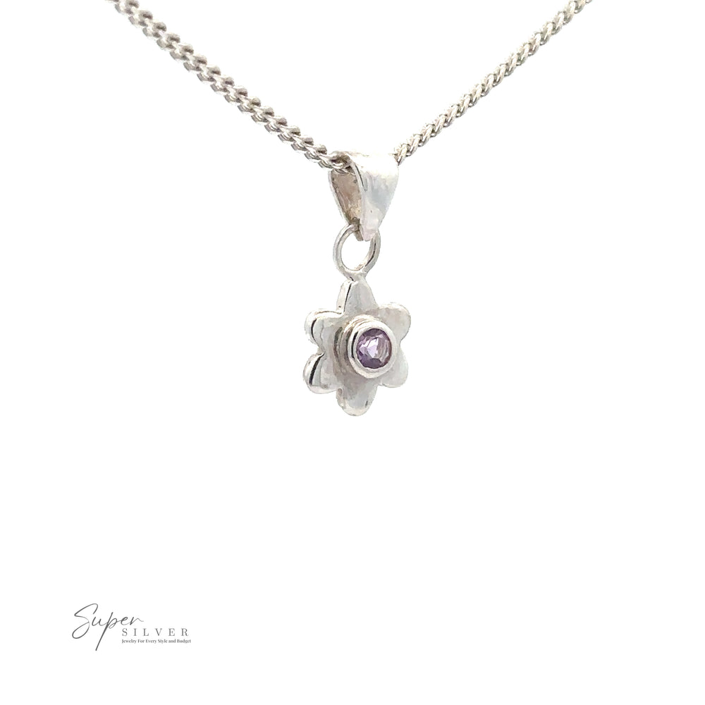 Tiny Gemstone Flower Pendant: Sterling silver necklace with a flower-shaped pendant featuring a small purple gemstone in the center. "Super Silver" logo visible in the bottom left corner.