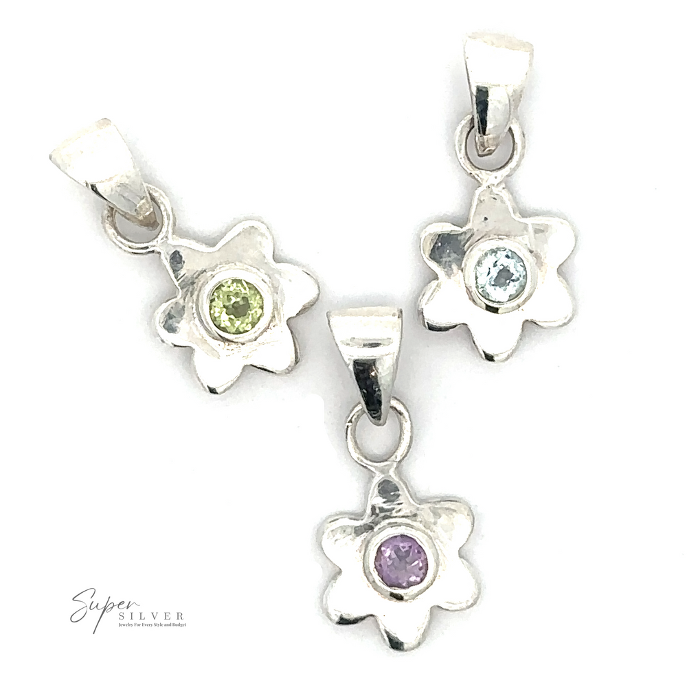 Three Tiny Gemstone Flower Pendants each feature a single gemstone center: one green, one blue, and one purple. The brand "Super Silver" is visible in the bottom left corner.