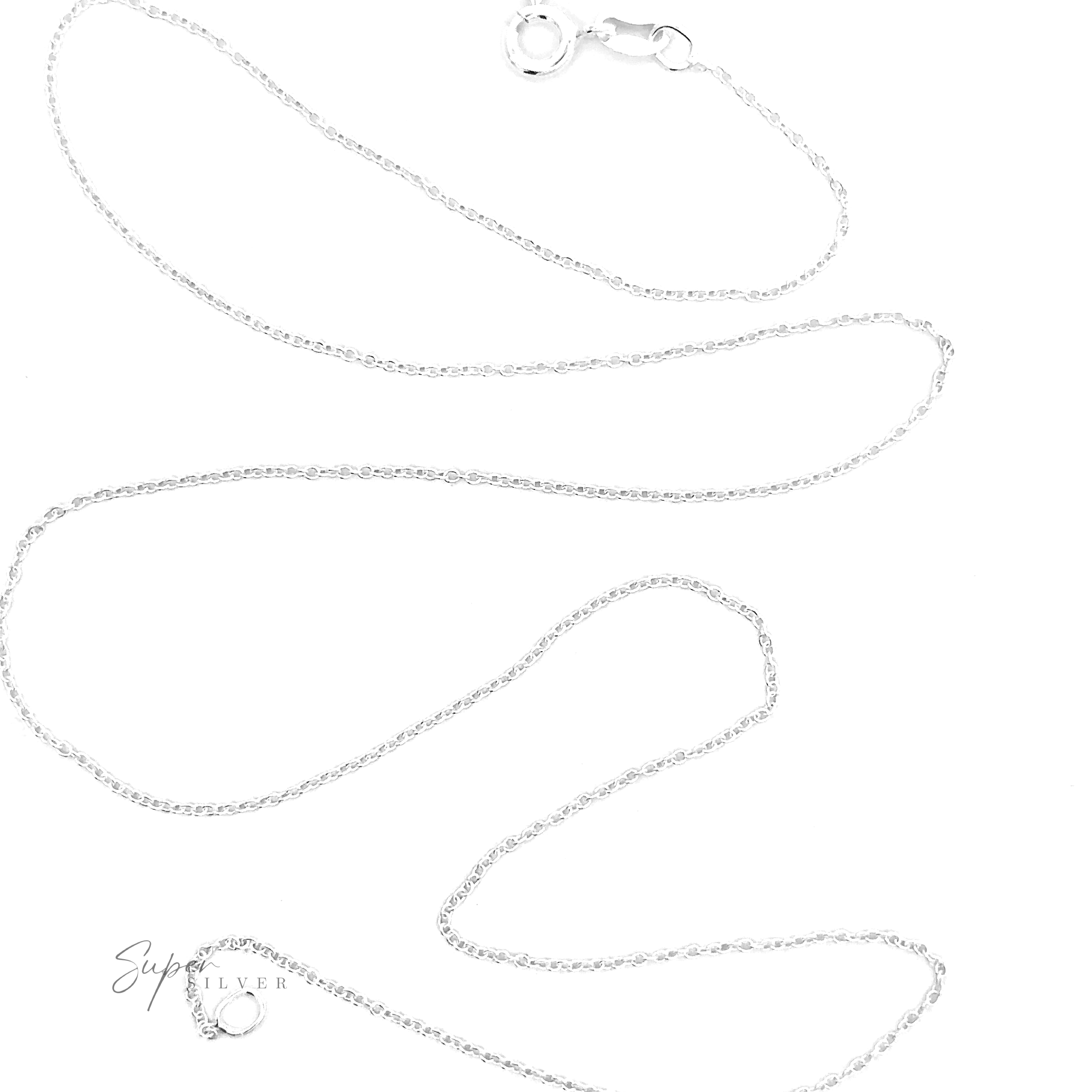 The Dainty Cable Chain is a delicate .925 Sterling Silver necklace with a small round clasp. The stylish chain is laid out in a loose, curving arrangement on a plain white background.