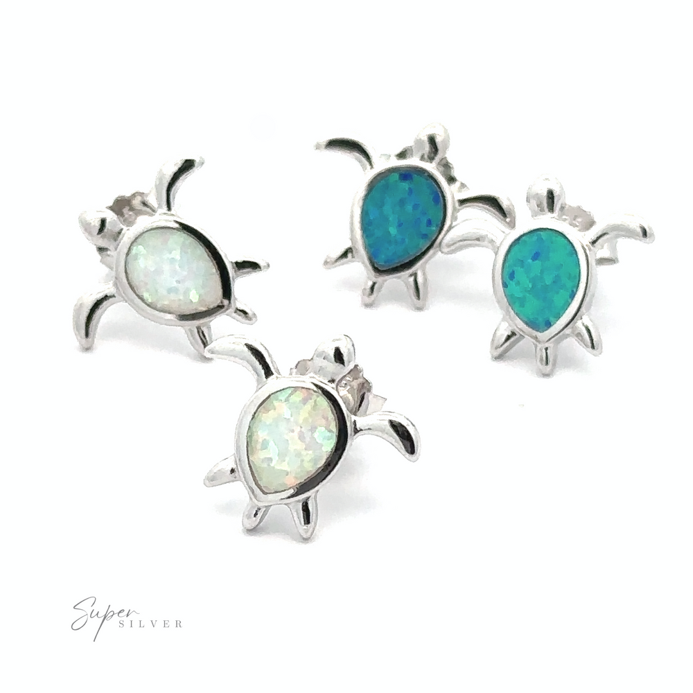 
                  
                    Four Simple Lab-Created Opal Turtle Studs crafted from sterling silver, featuring blue and white lab-created opal stones on a white background, labeled "Super Silver.
                  
                