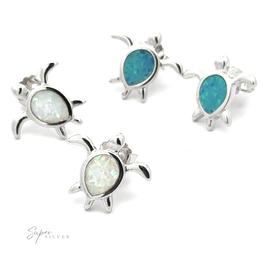 Four pairs of Simple Lab-Created Opal Turtle Studs: three with blue opal inlays and one with a white opal inlay, all crafted from small sterling silver. The text "Super Silver" appears in the bottom left corner.