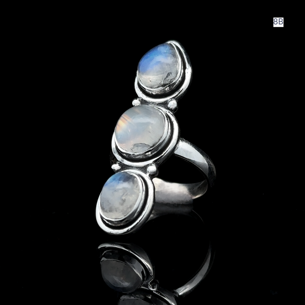 
                  
                    The Triple Moonstone Ring is crafted from sterling silver and features three oval moonstones arranged vertically on a dark backdrop, radiating powerful goddess energy.
                  
                