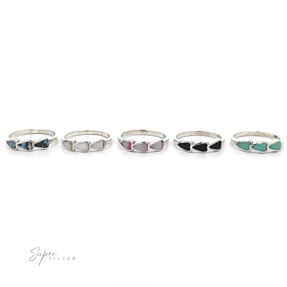 
                  
                    A set of five Triple Heart Rings with Inlaid Stones in different colors.
                  
                