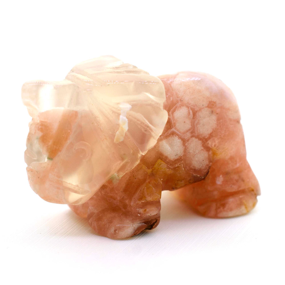 Elephant Carved Gemstone Figures on a white surface.
