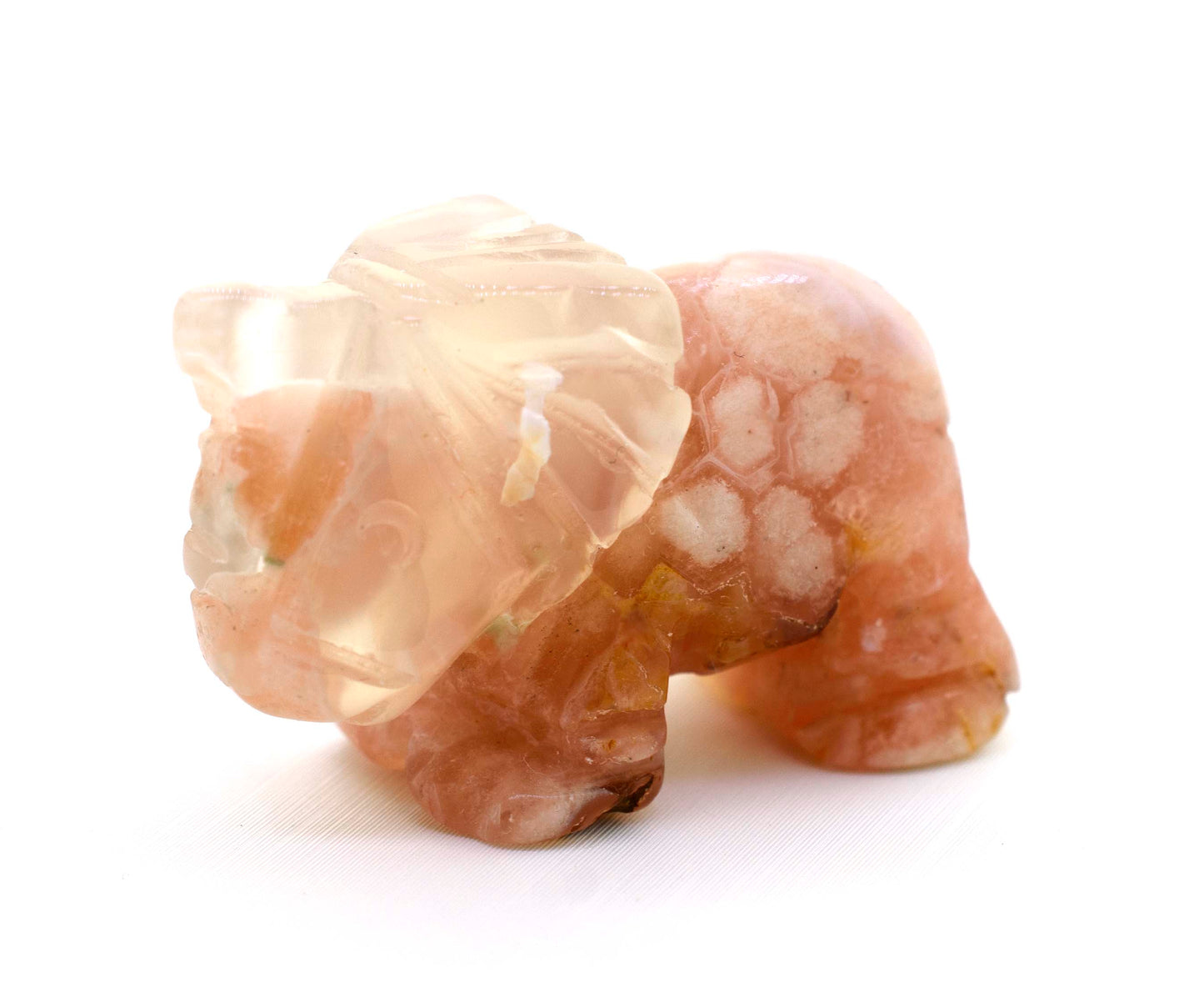 Elephant Carved Gemstone Figures on a white surface.