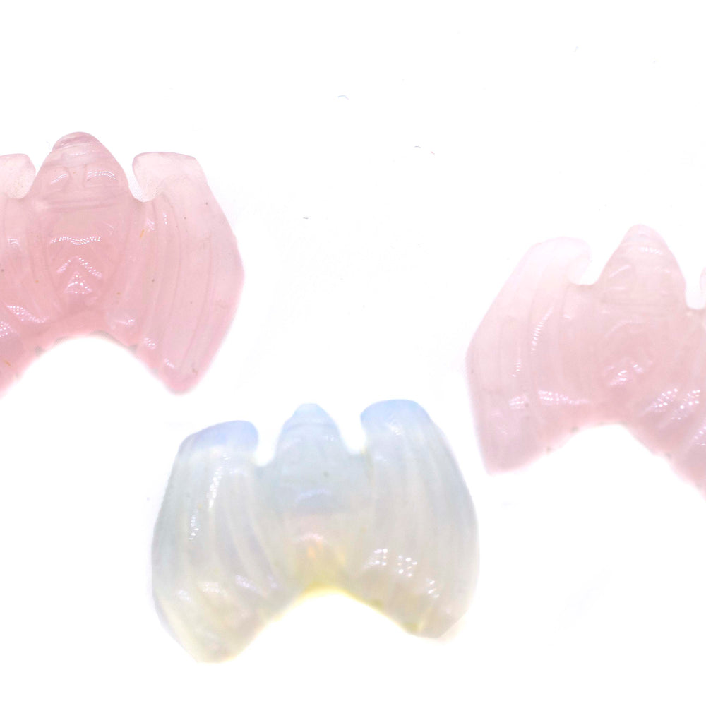 A set of three pink or white Bat Gemstone Figures perfect for decor.