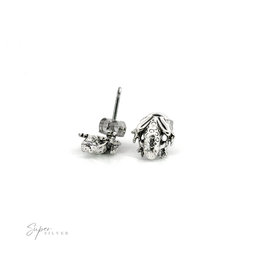 A pair of Frog Studs on a white background.