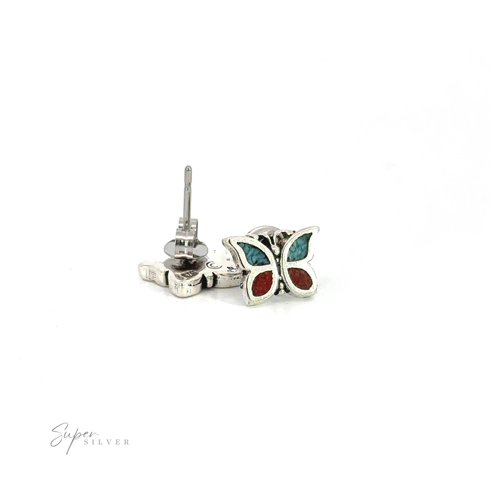 A whimsical pair of Coral and Turquoise Butterfly Studs on a white background.