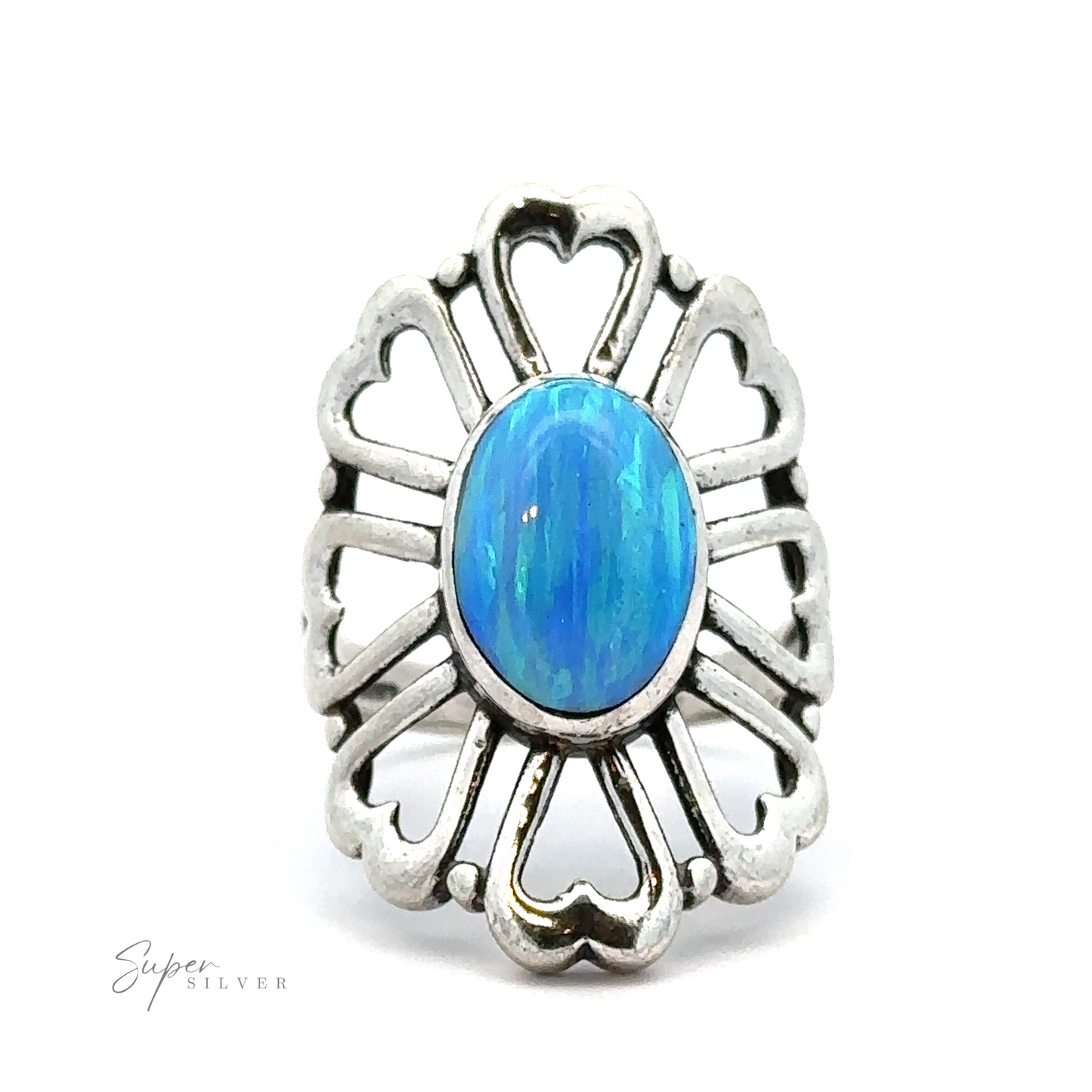 
                  
                    An American Made Opal Flower Ring with Heart Shaped Petals featuring a large oval blue gemstone at its center, surrounded by intricate heart-shaped cut-out designs. The words "Handcrafted in America" are visible in the lower left corner.
                  
                