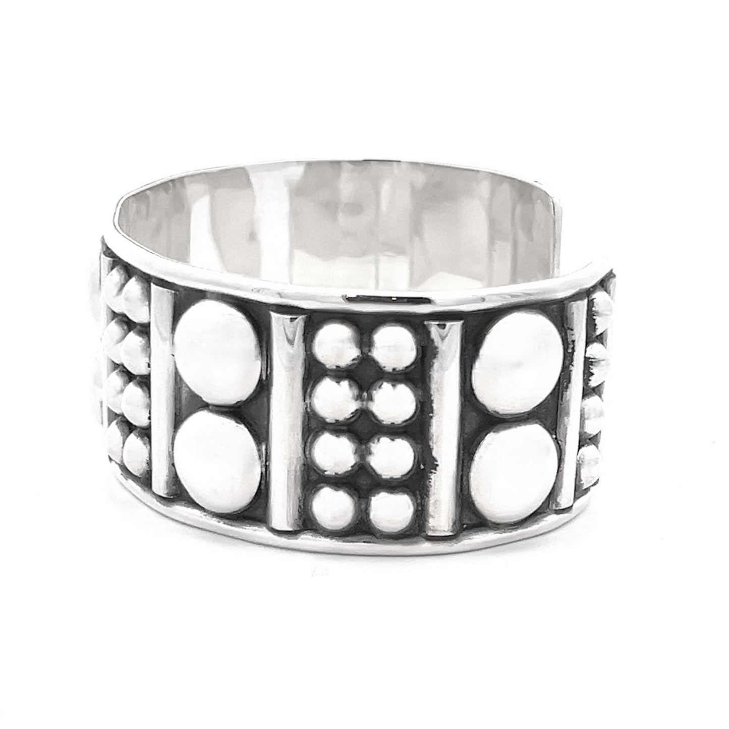 
                  
                    Bold Ball Patterned Cuff crafted in sterling silver featuring a textured design with raised circles and vertical lines, adding an edgy touch.
                  
                