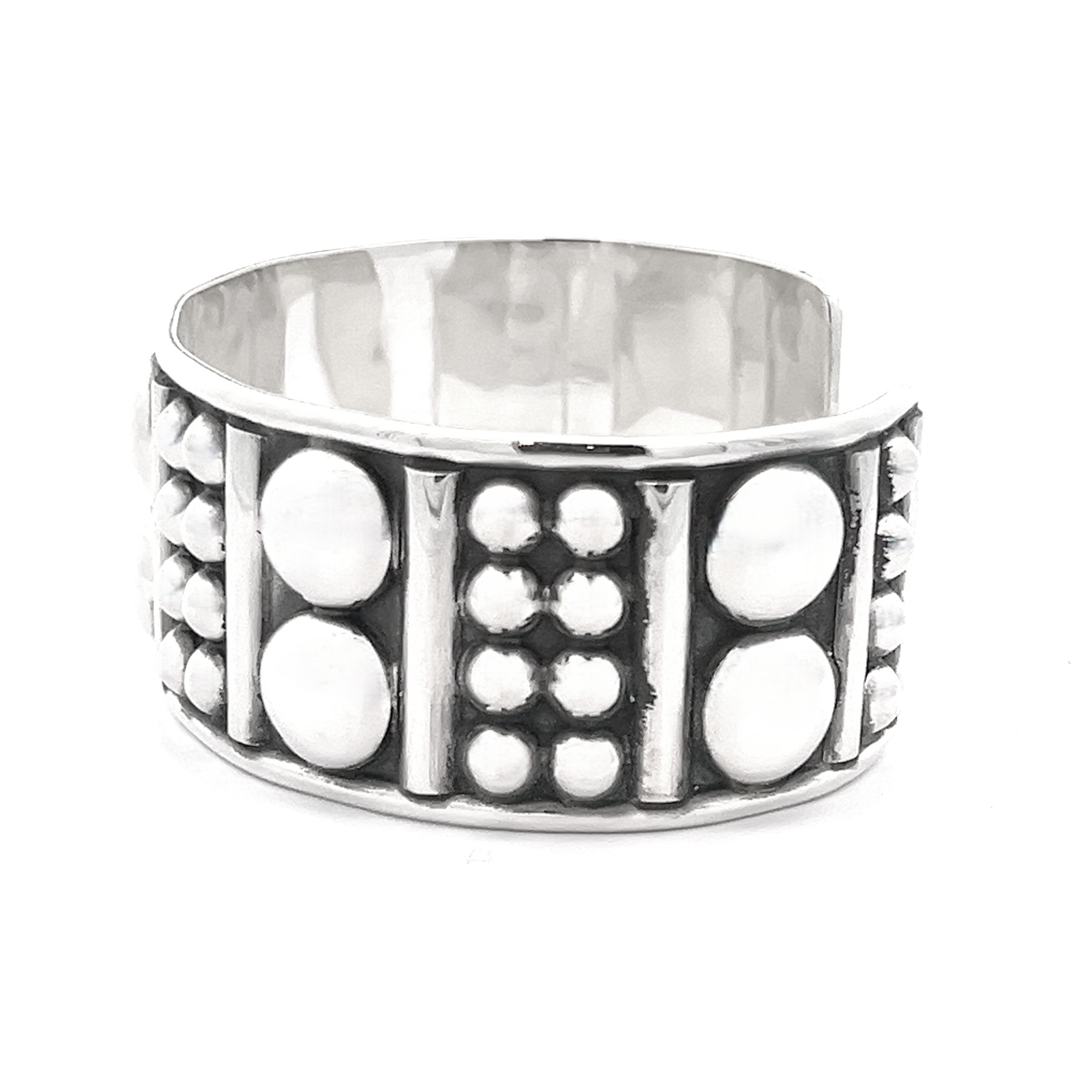Bold Ball Patterned Cuff crafted in sterling silver featuring a textured design with raised circles and vertical lines, adding an edgy touch.