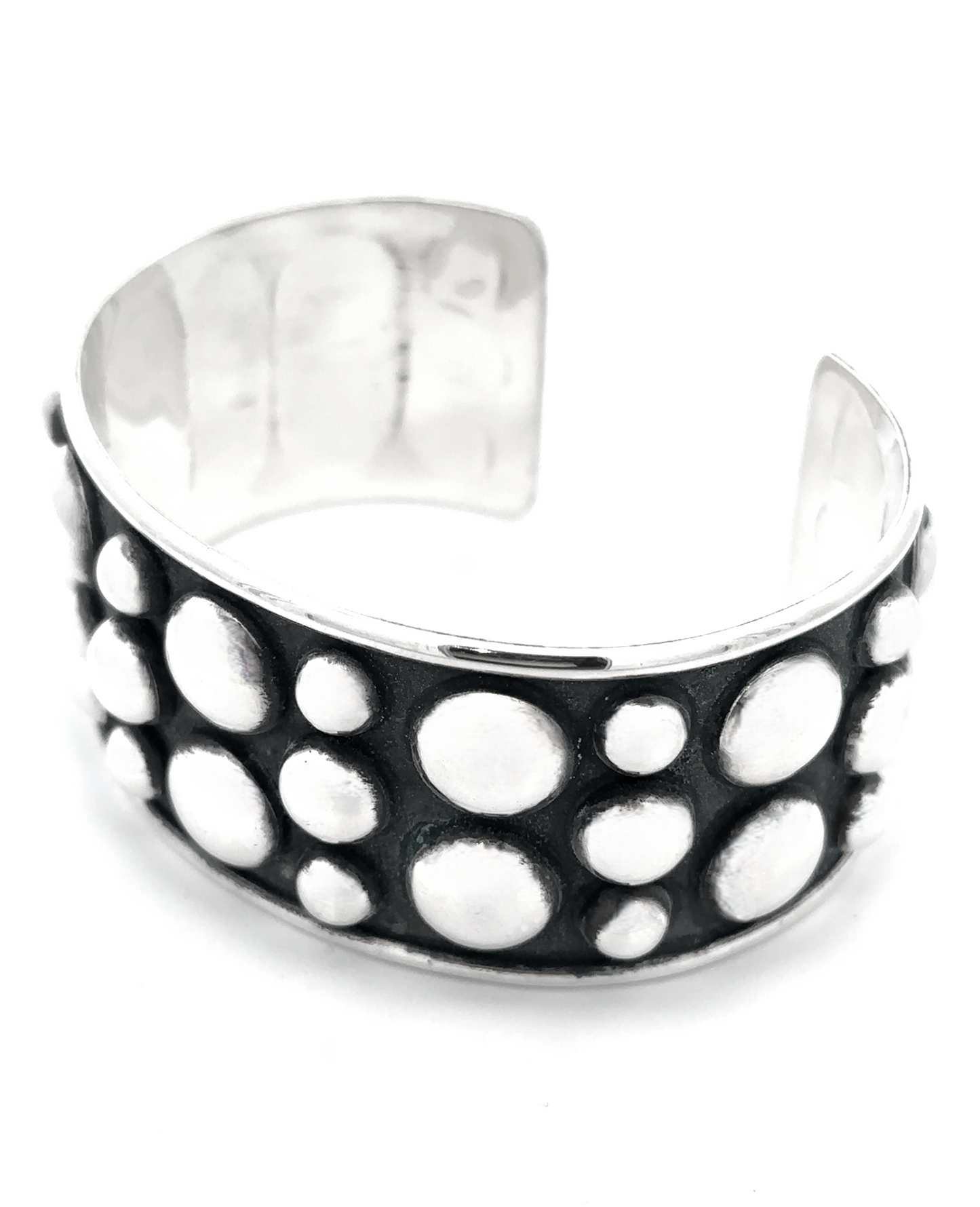 
                  
                    Unique Ball Studded Cuff with a striking design of raised circular dots on a dark background, emanating a rebellious vibe.
                  
                