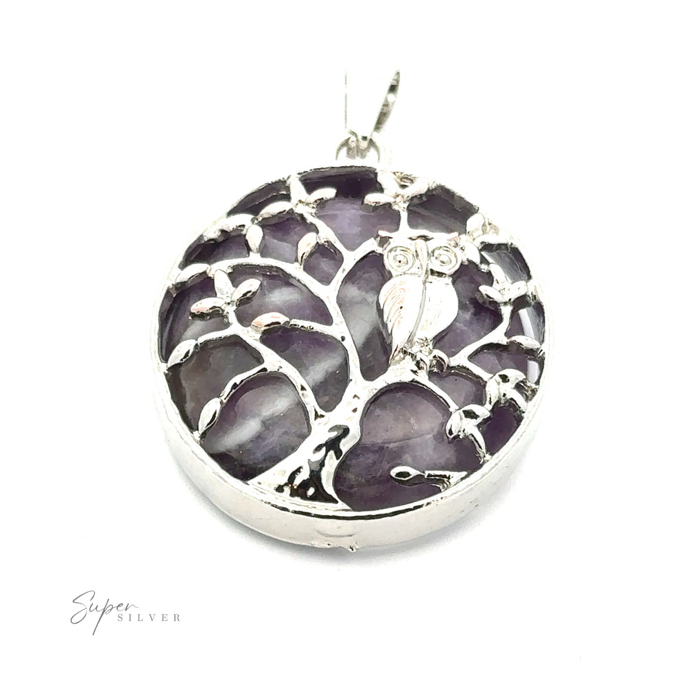 
                  
                    A circular silver pendant featuring a tree with an owl perched on its branch. The background of this exquisite Owl and Tree Pendant includes shimmering purple amethyst stones. The "Super Silver" logo is elegantly etched in one corner, adding a touch of distinction.
                  
                
