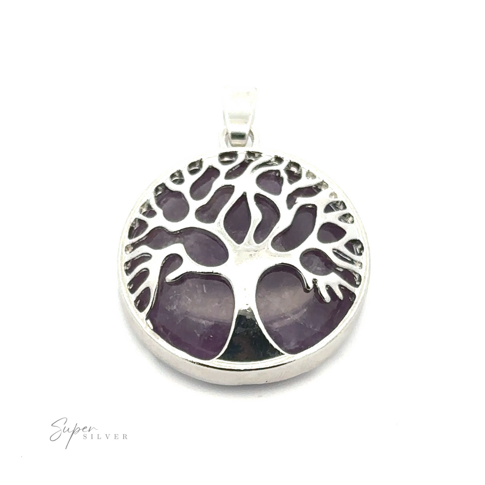 
                  
                    A Tree of Life Pendant featuring a round silver-plated design with a purple gemstone background. The lower section has the brand name "Super Silver" in small letters.
                  
                