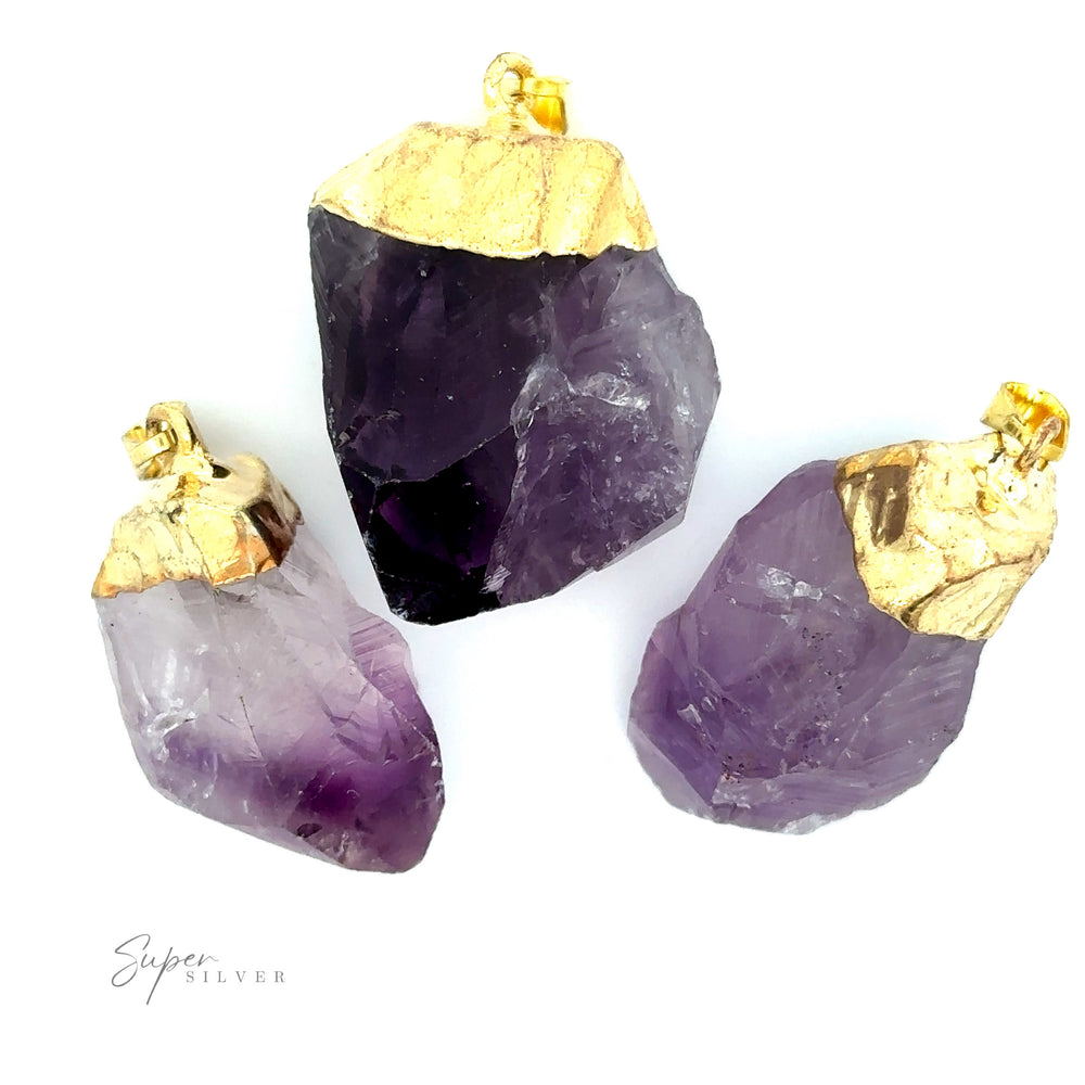 
                  
                    Three Raw Crystal Pendants With Gold Caps are displayed against a white background.
                  
                