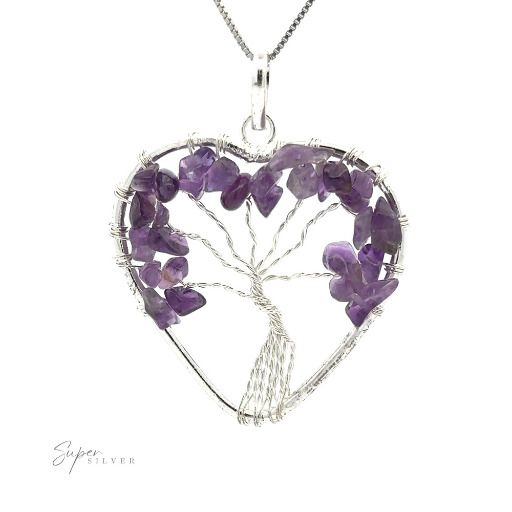 
                  
                    Heart Shaped Tree of Life Pendant featuring a wire wrapped tree of life design adorned with small purple gemstones.
                  
                