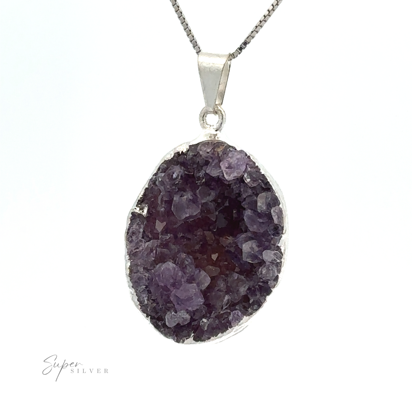 
                  
                    Close-up of an Amethyst Geode Pendant featuring a purple crystal on a silver chain against a white background. Encased in silver-plated casing, the Amethyst Geode Pendant has rough, faceted edges, and the inscription "Super Silver" is visible at the bottom left.
                  
                