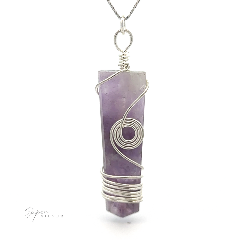 
                  
                    Stone Slab Pendant with Wire Wrapping on a silver chain. This exquisite wire wrapped jewelry piece features an elongated and tapered bottom, making it a standout Gemstone pendant for any collection.
                  
                