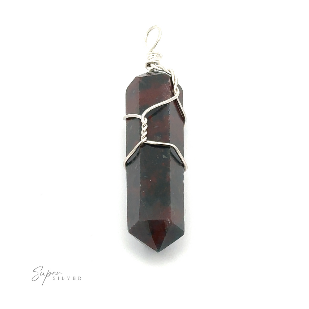 
                  
                    A polished, dark red crystal pendant wrapped in silver wire with a small loop at the top for hanging. The Wire Wrapped Stone Pendant branding is visible in the bottom left corner, enhancing the elegance of this Bloodstone treasure.
                  
                