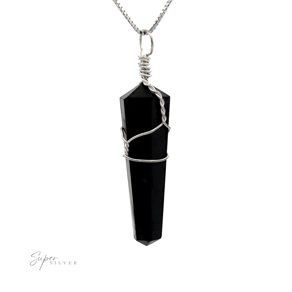 
                  
                    A striking black crystal wrapped in silver wire, hanging from a silver chain. The Wire Wrapped Stone Pendant, reminiscent of refined elegance, is displayed on a plain white background.
                  
                