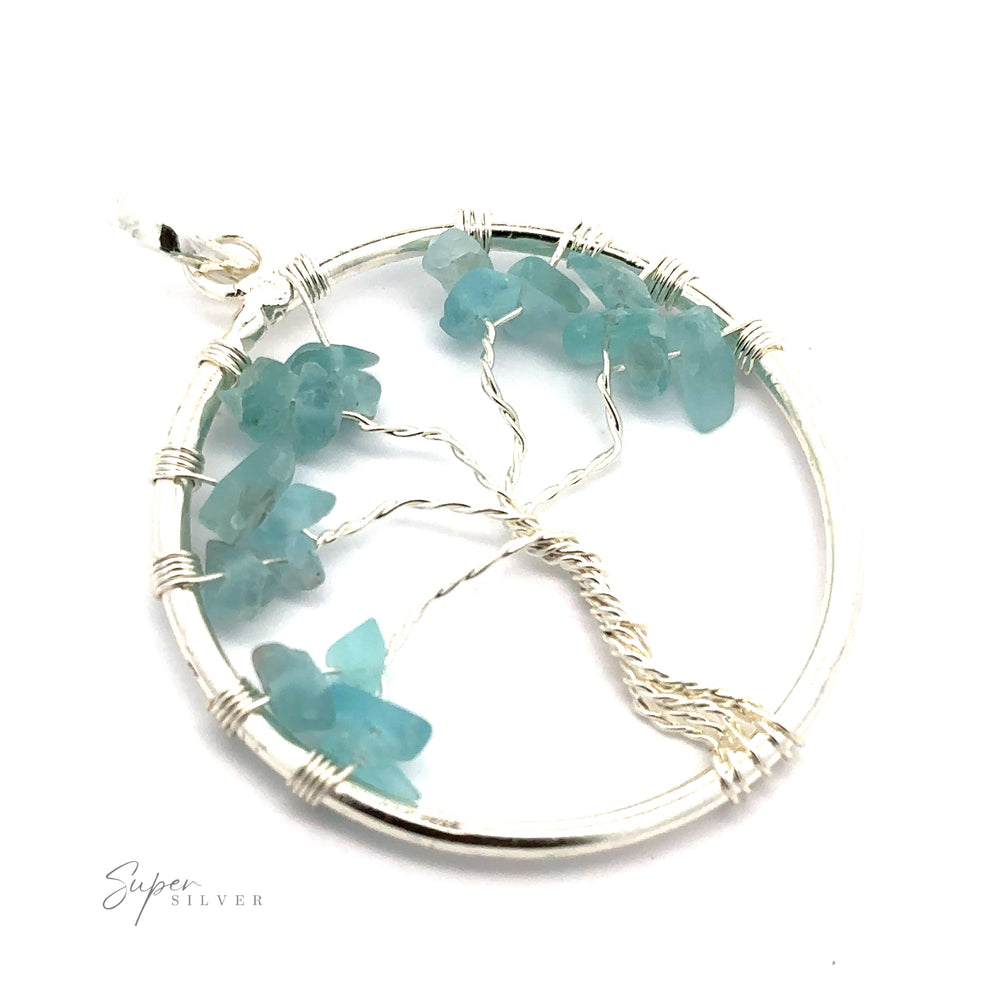 
                  
                    Discover the Wire Wrapped Tree of Life Pendant with Stones, a circular masterpiece with wire-wrapped design featuring turquoise gemstones as leaves. Silver wire expertly forms the branches and trunk, creating a stunning accessory.
                  
                