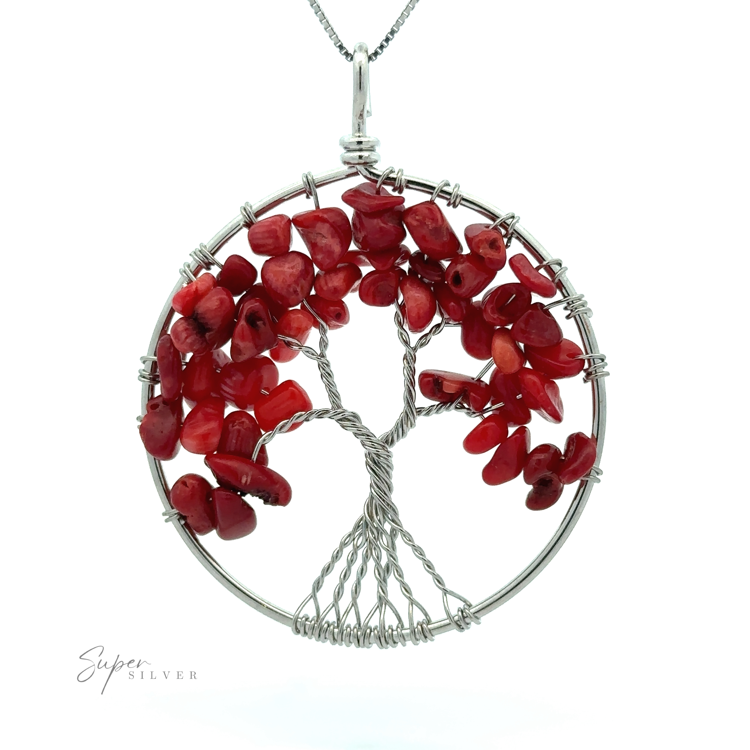 A round Wire Wrapped Tree of Life Pendant crafted from mixed metals features a tree design made with silver wire and adorned with red gemstone chips as leaves. The pendant hangs elegantly from a thin silver chain. The text "Super Silver" is visible at the bottom left.