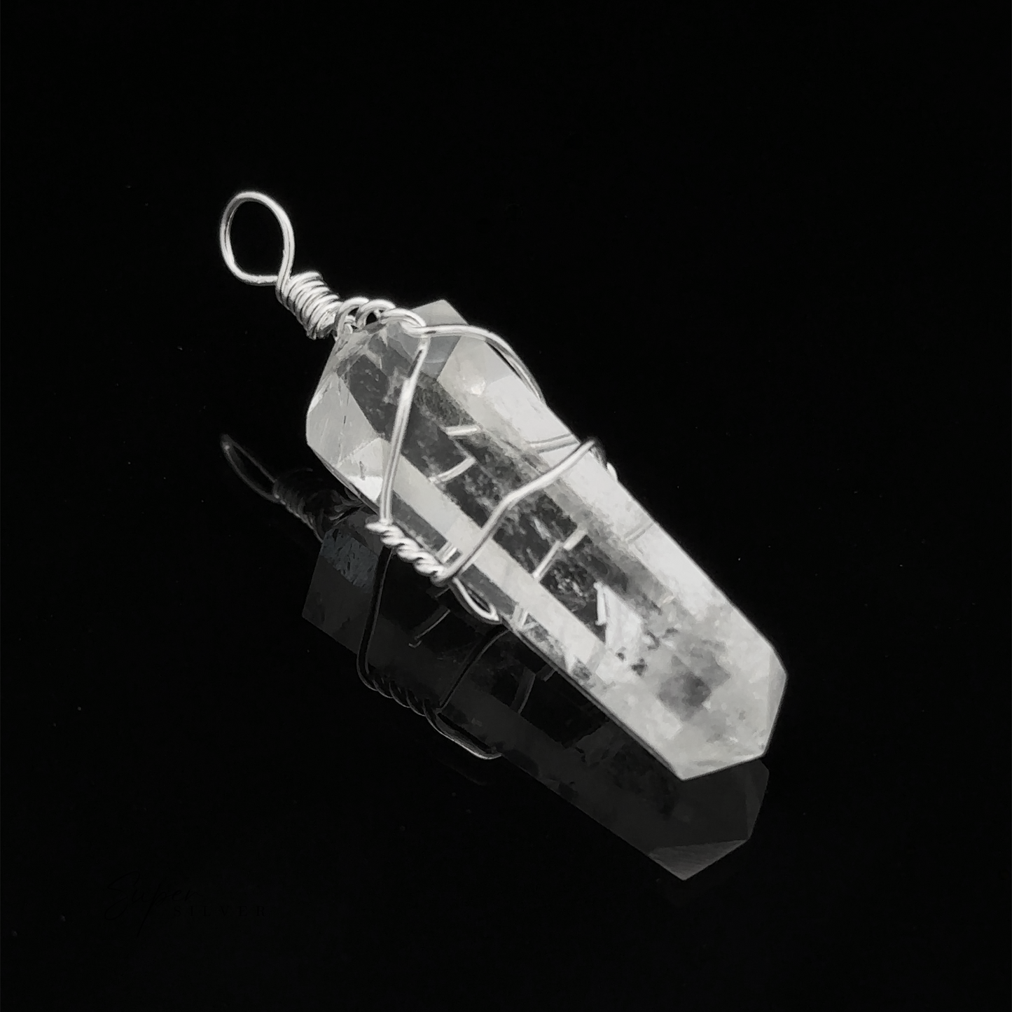 
                  
                    A Wire Wrapped Stone Pendant, set against a black background, exudes elegance and mystique, reminiscent of the timeless beauty found in minerals like selenite.
                  
                