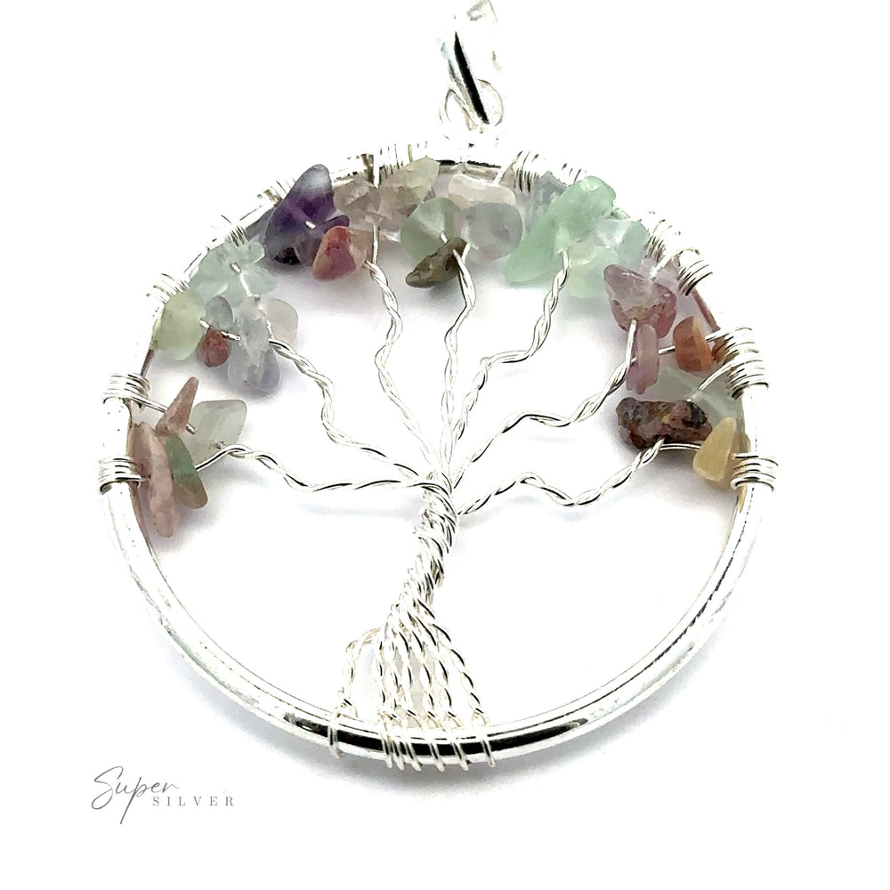 
                  
                    A stunning silver Wire Wrapped Tree of Life Pendant with Stones featuring wire-wrapped branches and multicolored gemstone leaves on a circular frame. This exquisite piece is expertly crafted by Super Silver.
                  
                