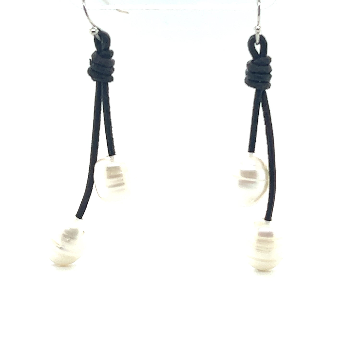 A pair of Super Silver black and white Leather Cord and Pearl Earrings with a laid-back style and leather loop.