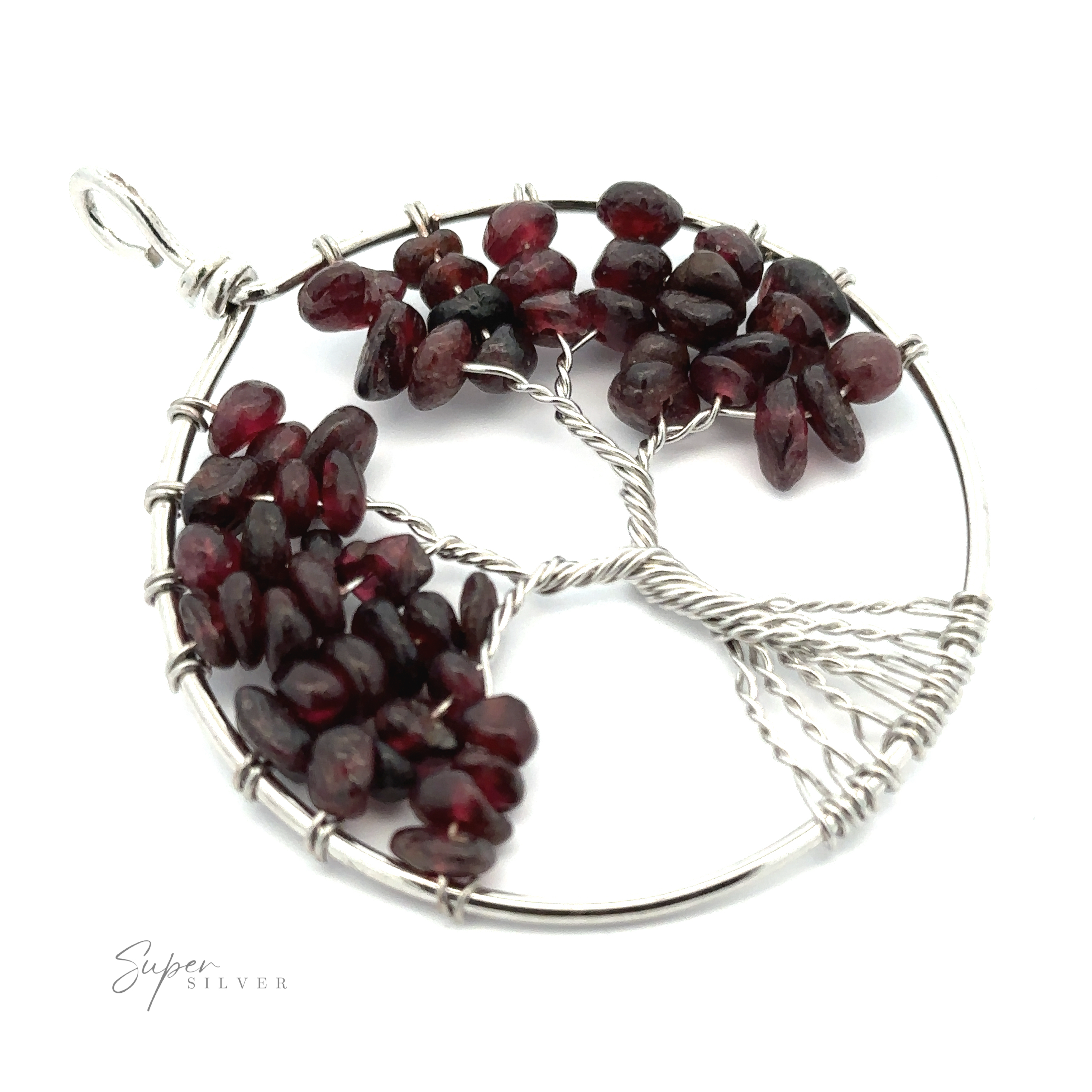 A round, silver Wire Wrapped Tree of Life Pendant featuring a tree design. The tree's foliage is represented by dark red gemstones. The words "Super Silver" are visible at the bottom of the image.