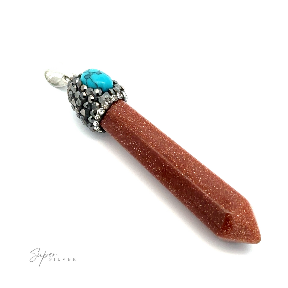 
                  
                    Close-up of an Obelisk Crystal Pendant featuring a pointed, brown stone with a turquoise accent and silver detailing at the top. The pendant is labeled "Stone Obelisk Pendant" in the corner.
                  
                