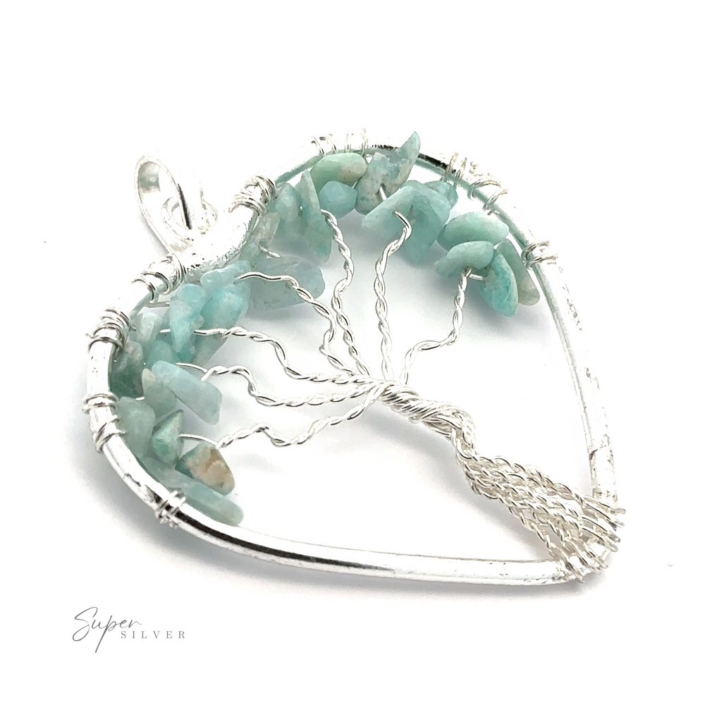 
                  
                    A Heart Shaped Tree of Life Pendant with turquoise stones arranged to resemble a wire wrapped tree of life inside the heart frame.
                  
                