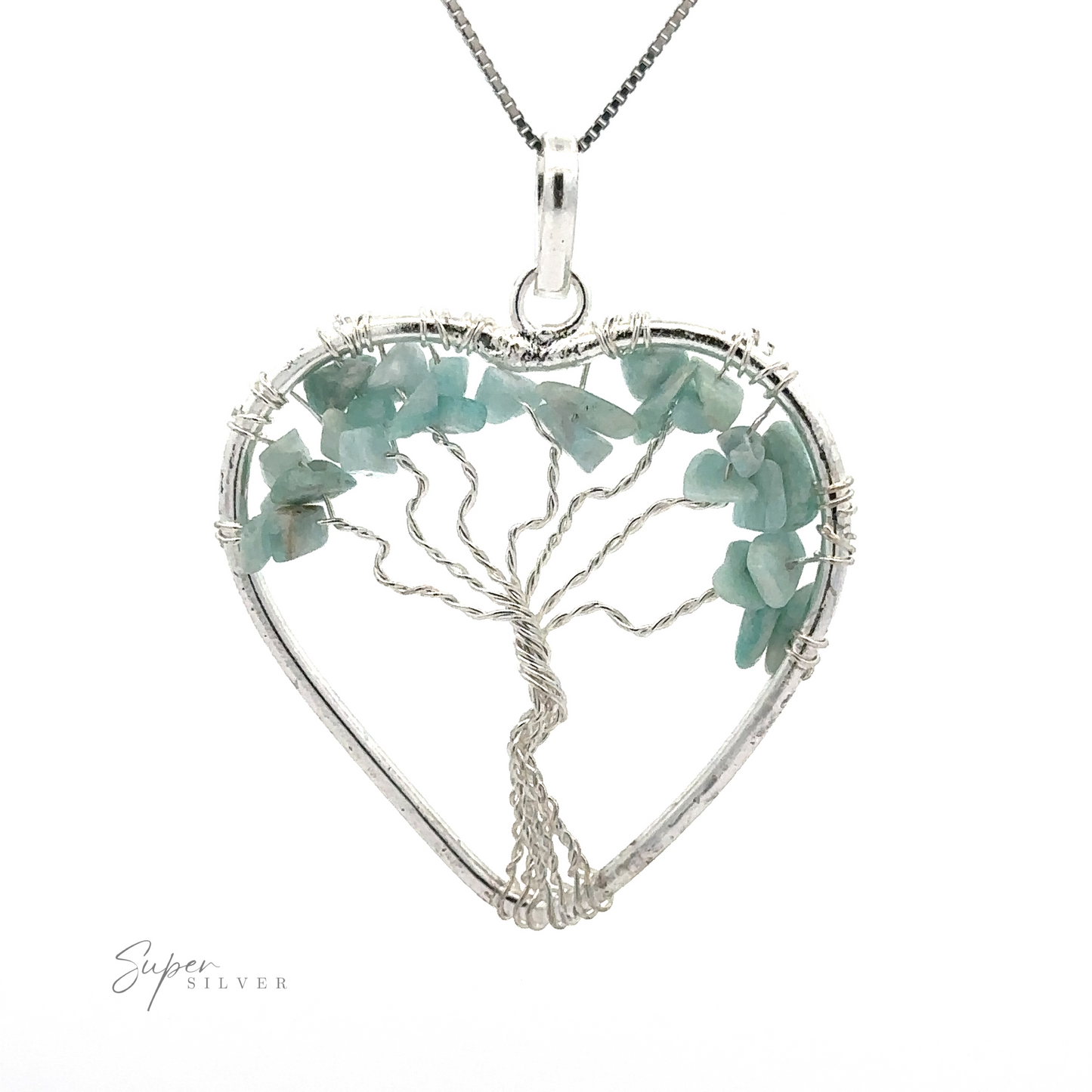 
                  
                    A Heart Shaped Tree of Life Pendant featuring a wire-wrapped tree of life design, adorned with light green raw stone beads, elegantly suspended on a silver chain.
                  
                