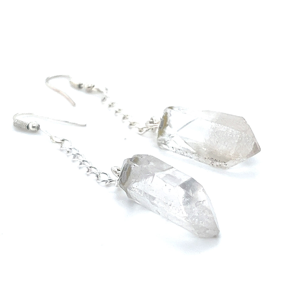 
                  
                    These Super Silver Long Crystal Earrings With Chain are crafted from sterling silver and adorned with clear quartz crystals, making them perfect for any bohemian earth lover seeking raw crystal accessories.
                  
                