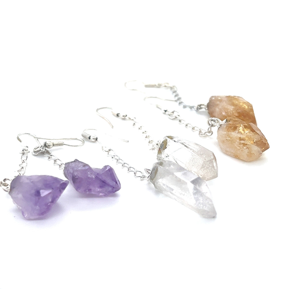 
                  
                    Bohemian-inspired Long Crystal Earrings With Chain for the earth-loving fashionista. These dangle earrings, by Super Silver, feature raw amethyst crystals, perfect for adding a touch of natural beauty to any outfit.
                  
                