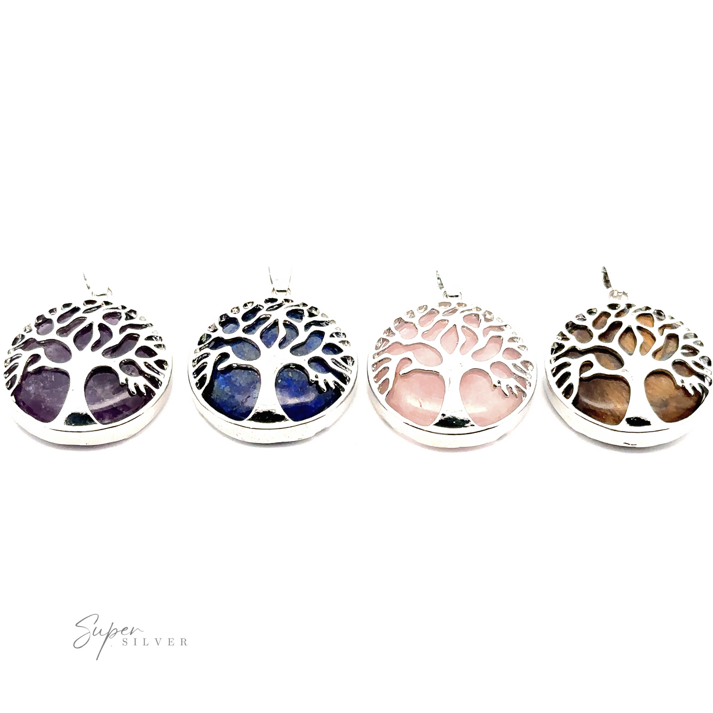 Four circular Tree of Life Pendants with gemstone backgrounds in purple, blue, pink, and brown, set in silver plated frames. The "Super Silver" logo is visible in the bottom left corner.