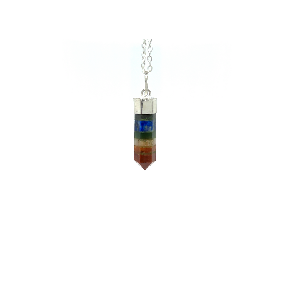 
                  
                    A Chakra Crystal Point Pendant by Super Silver, with a rainbow colored stone, radiating energy.
                  
                
