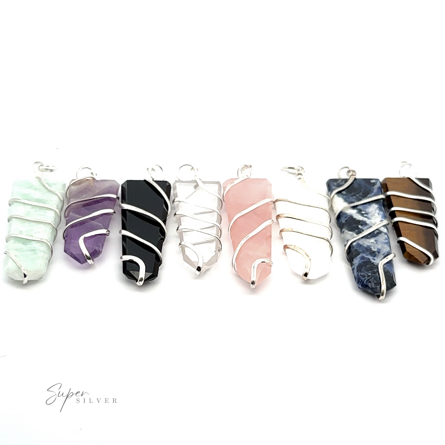 A row of seven stunning gemstone jewelry pieces wrapped in silver wire. These Wire Wrapped Slab Pendant showcase crystals of varying colors such as green, purple, black, pink, blue, and brown.