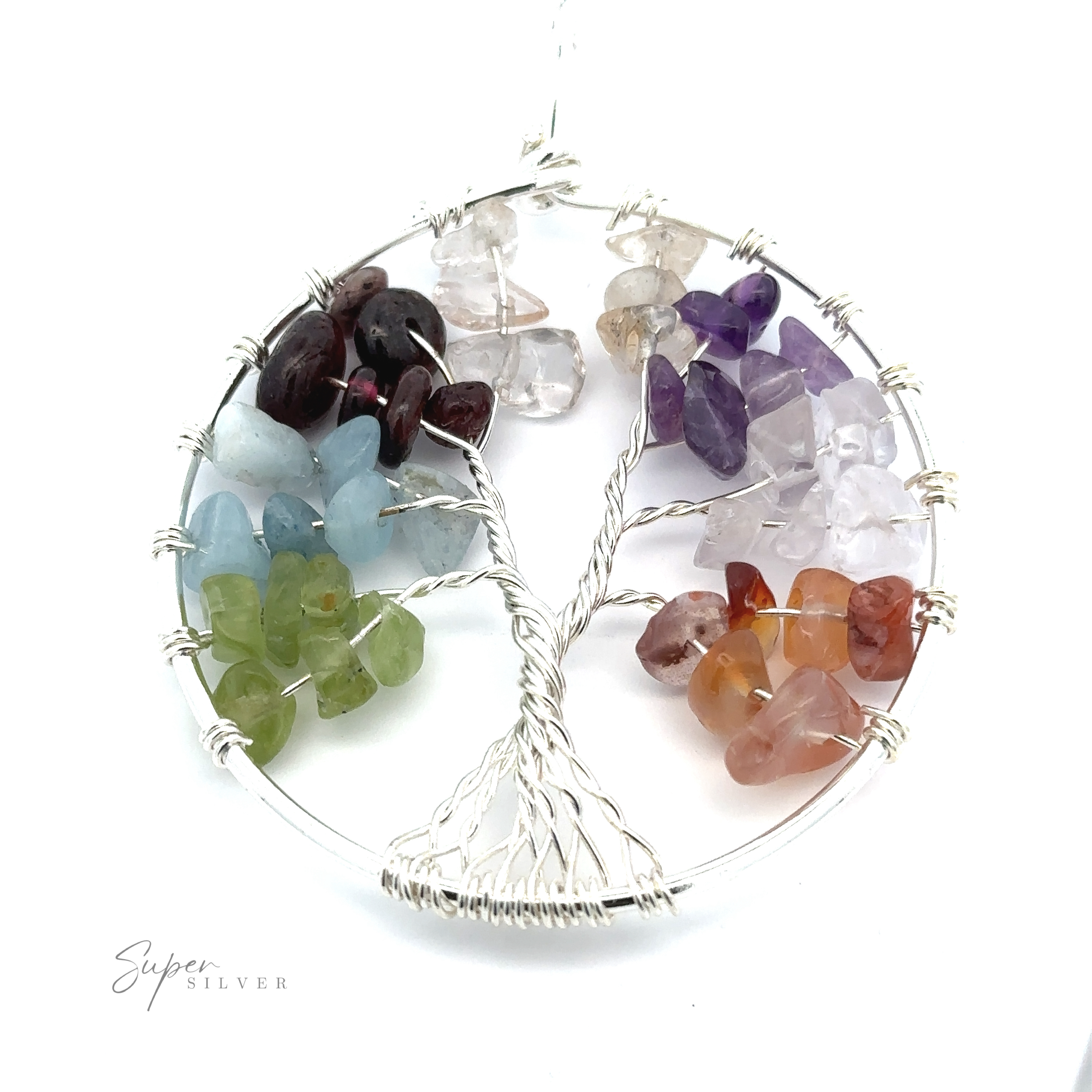 A Wire Wrapped Tree of Life Pendant shaped from mixed metals, adorned with colorful gemstone chips representing leaves, is artfully arranged in vibrant sections across its branches.