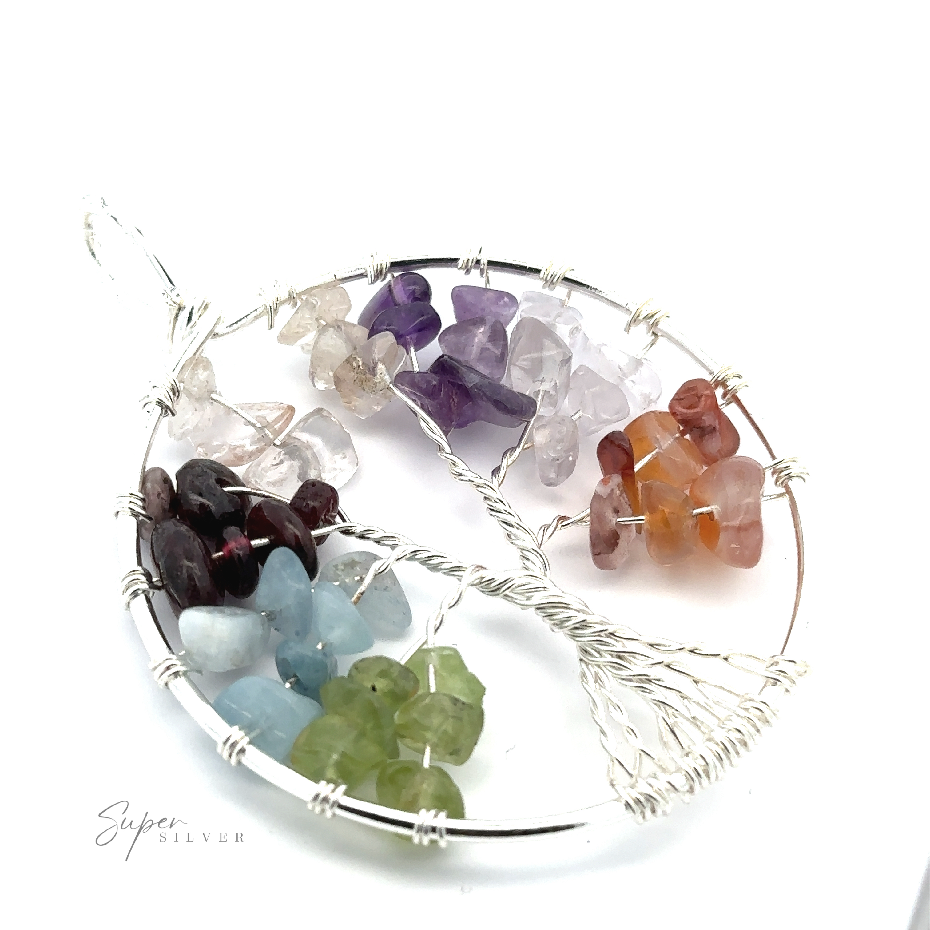 A Wire Wrapped Tree of Life Pendant crafted from mixed metals, featuring clusters of various colored crystals forming a vibrant tree. The circular wire decoration is silver, with gemstones in clear, purple, orange, green, blue, and dark red hues.