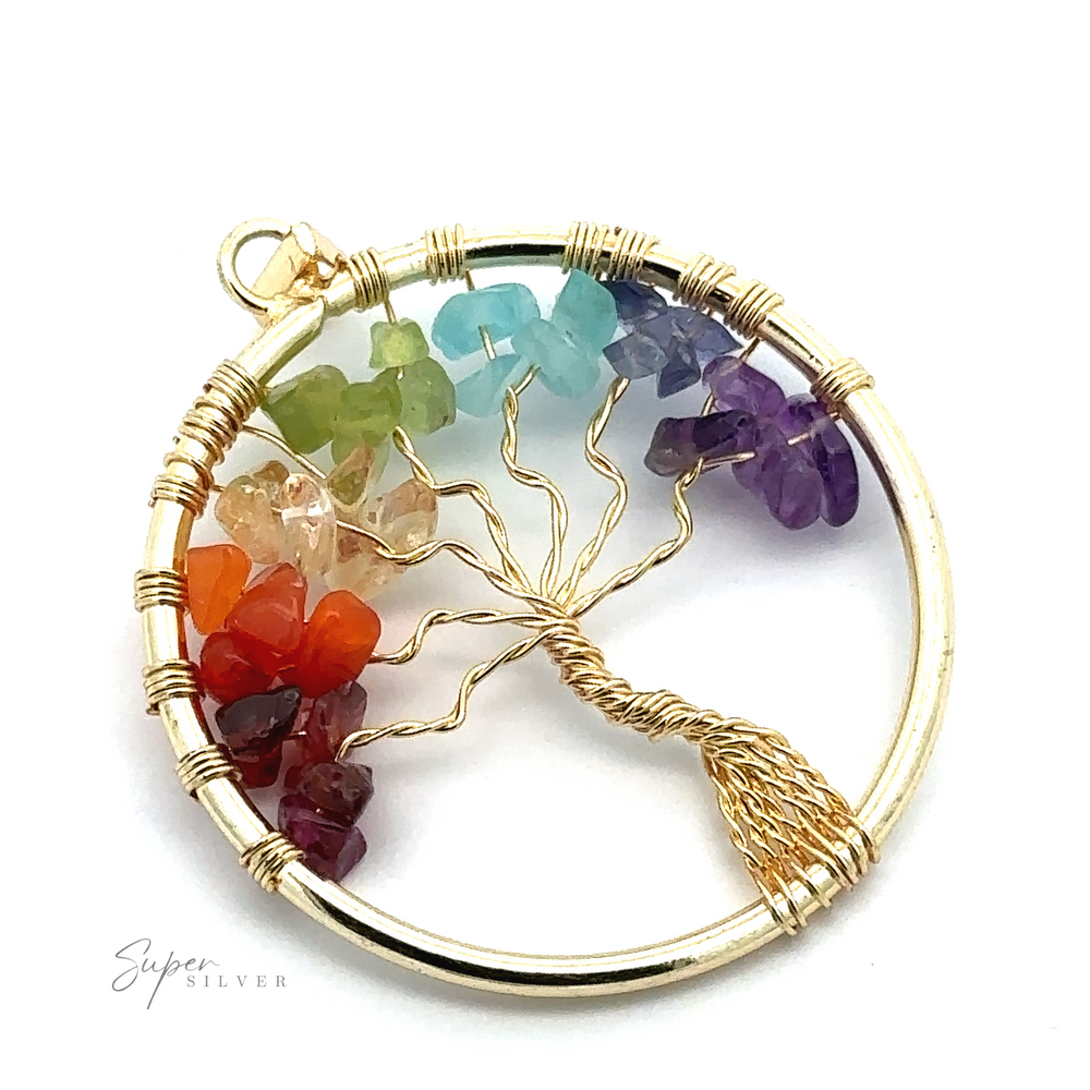 
                  
                    A Wire-Wrapped Chakra Tree of Life Pendant featuring a silver frame and a gold wire-wrapped tree inside. The tree branches are adorned with multicolored chakra stones, adding a vibrant touch to this exquisite piece.
                  
                