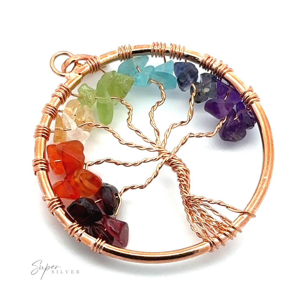 
                  
                    A stunning Wire-Wrapped Chakra Tree of Life Pendant featuring a twisted tree made of copper wire inside a circular frame, decorated with various colored gemstones representing different chakras. This wire-wrapped beauty is perfect for those who appreciate unique jewelry and the symbolism of chakra stones.
                  
                