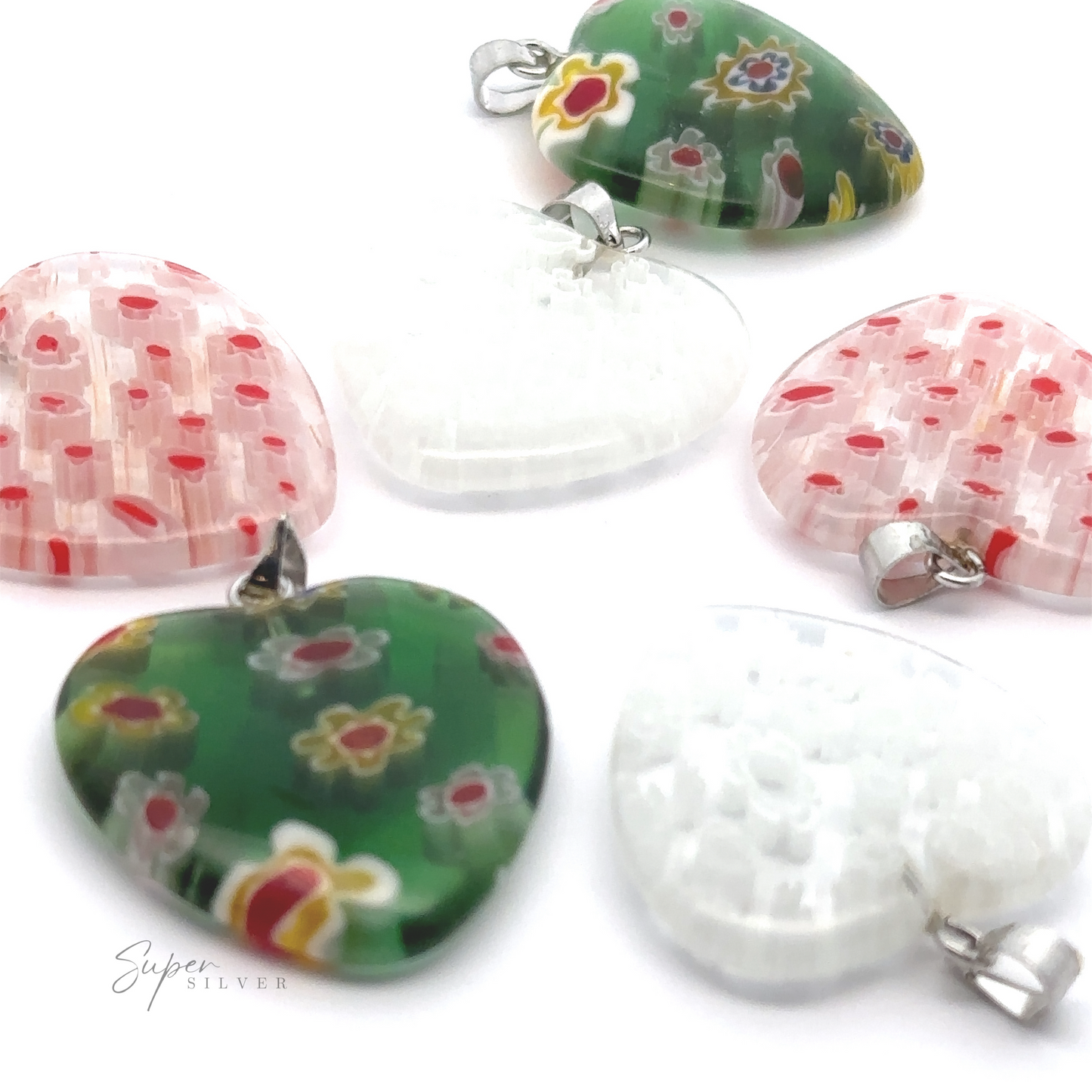 Six Heart Pendants with Flower Pattern in various colors, including white, green, and pink with floral designs, are arranged on a white background. The Super Silver logo is visible in the corner.