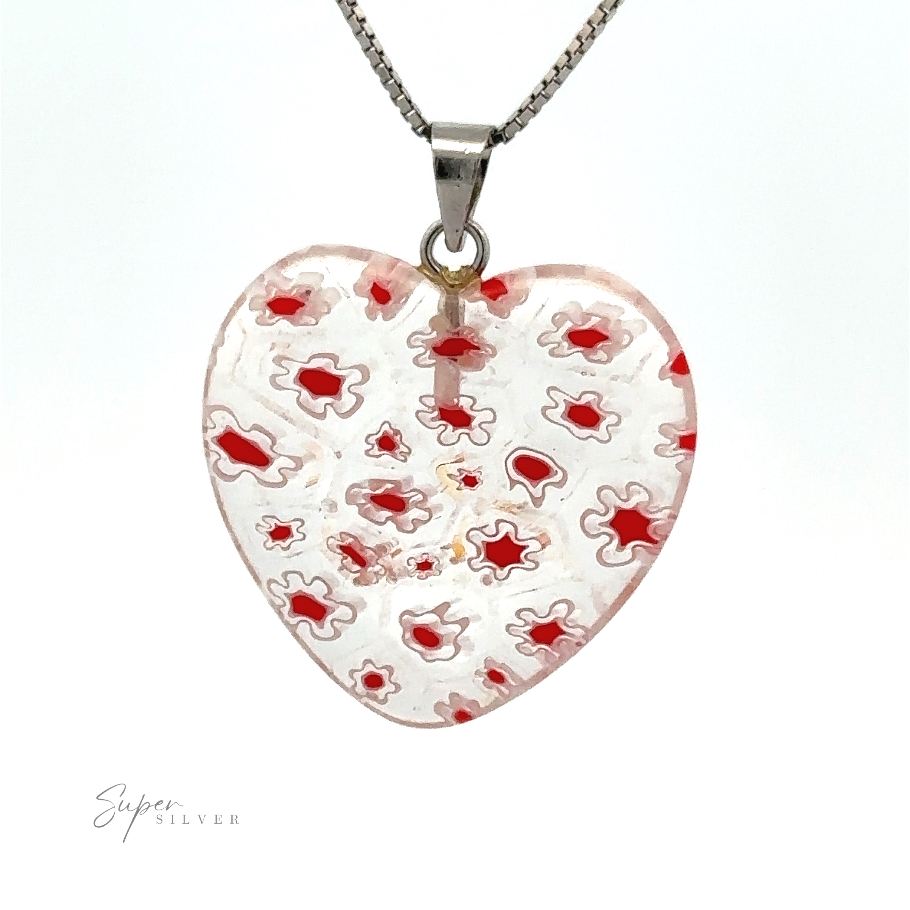 A Heart Pendant with Flower Pattern showcases a clear and red intricate pattern in translucent resin. The hallmark "Super Silver" is visible in the bottom left corner, adding a touch of authenticity to this charming piece.