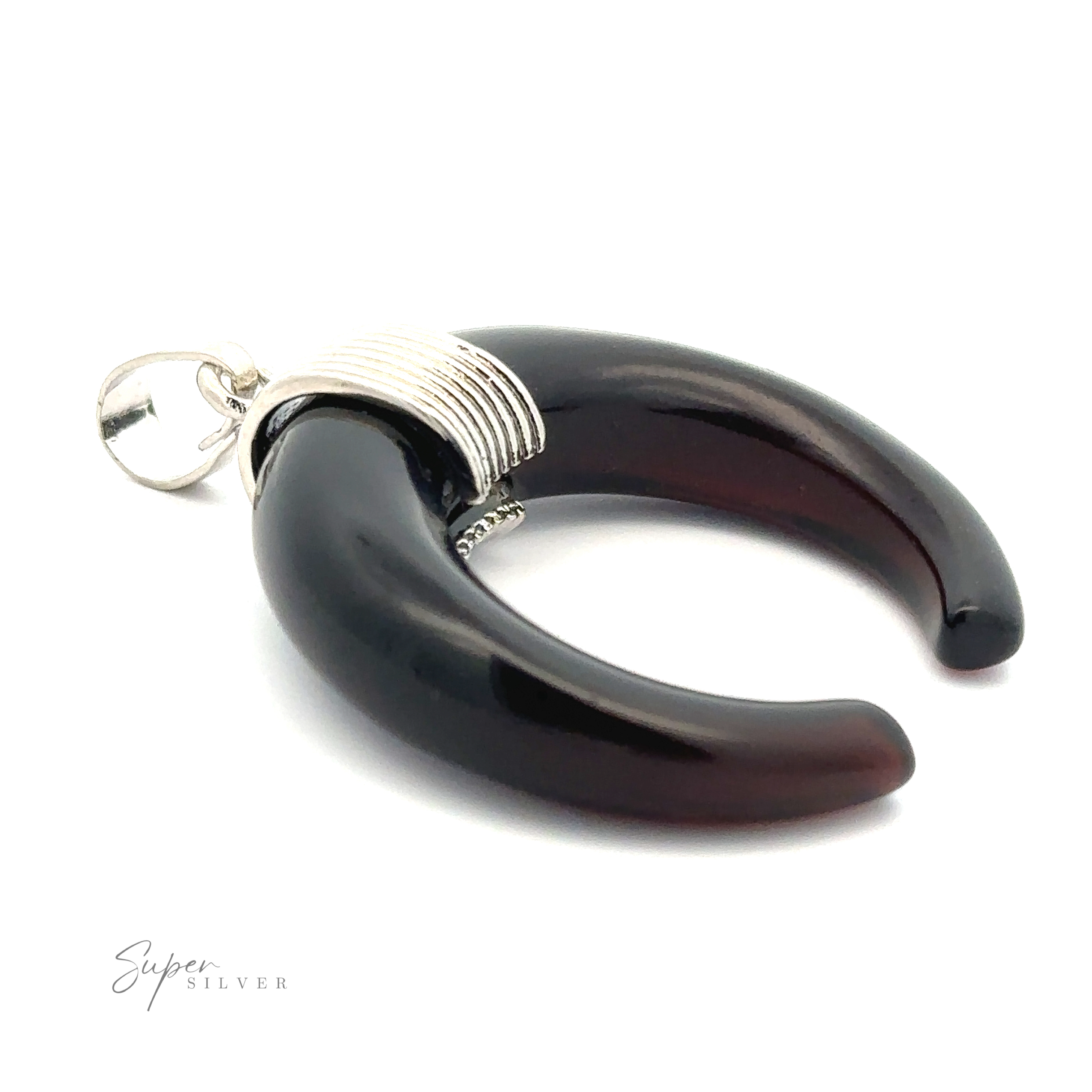 A black Naja Stone Pendant with a silver loop and wrapped silver wire detailing at the top. The crescent-shaped piece, inspired by Navajo design, is set against a white background with the "Super Silver" logo in the corner.