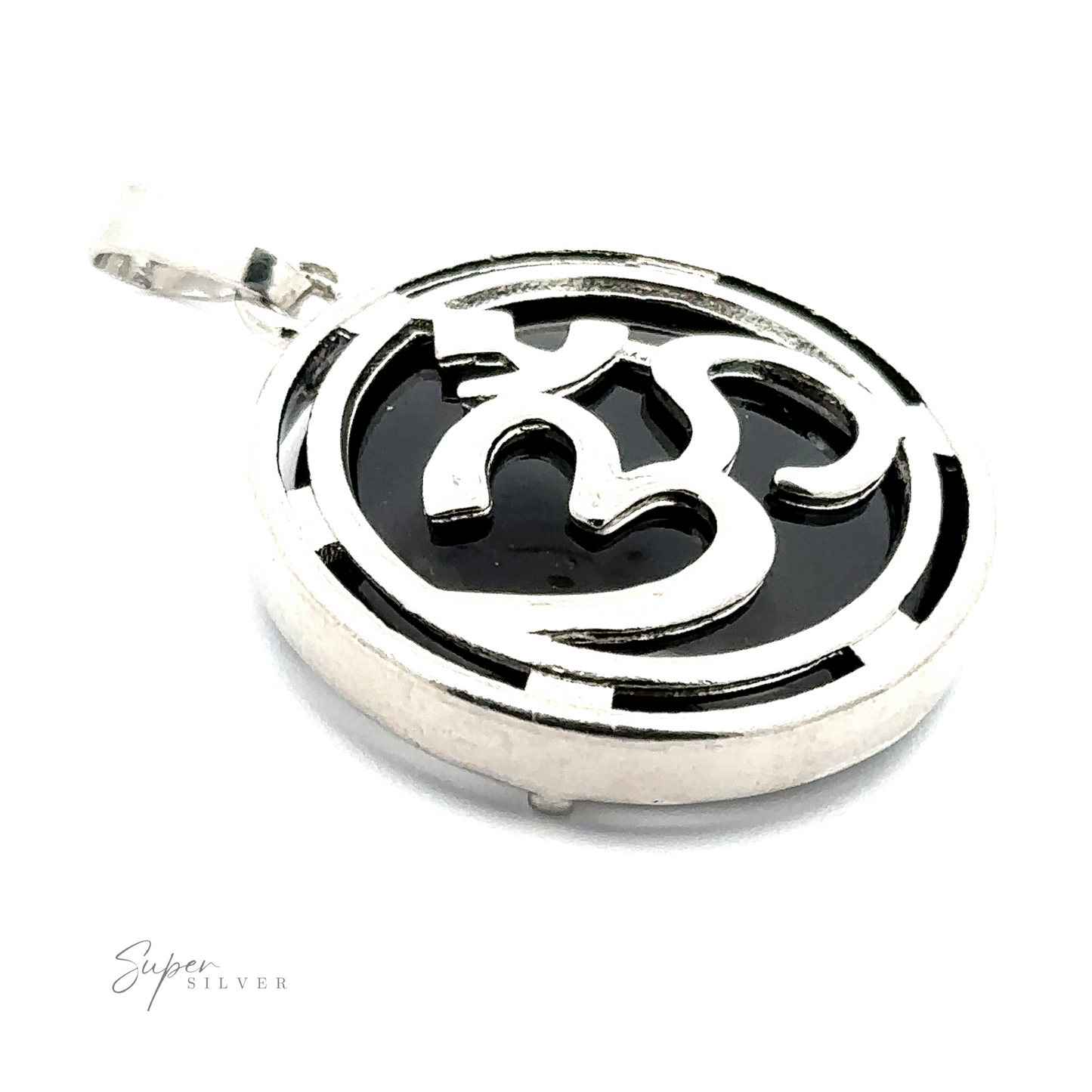 
                  
                    A silver-plated Om Pendant with a black background, featuring an intricate, stylized design.
                  
                