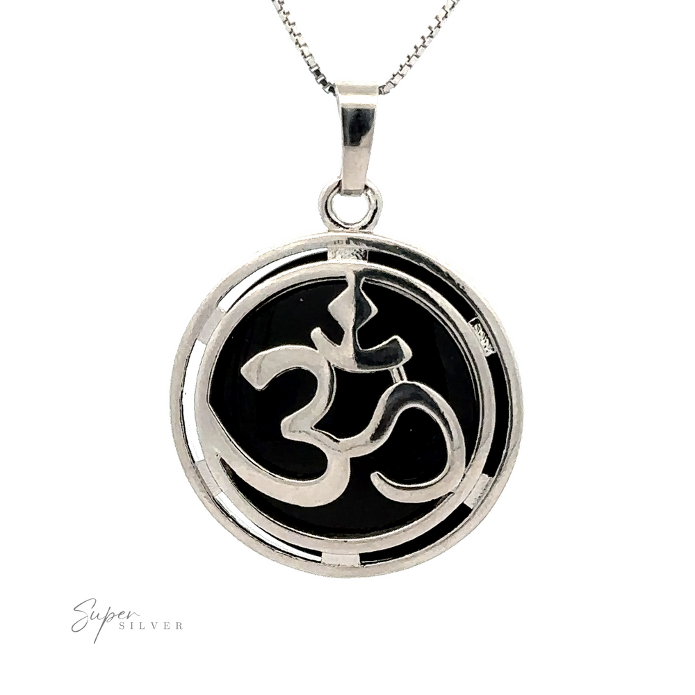 
                  
                    A silver plated Om Pendant featuring an "Om" symbol in the center against a black background, with subtle mixed metals for an added touch of elegance.
                  
                